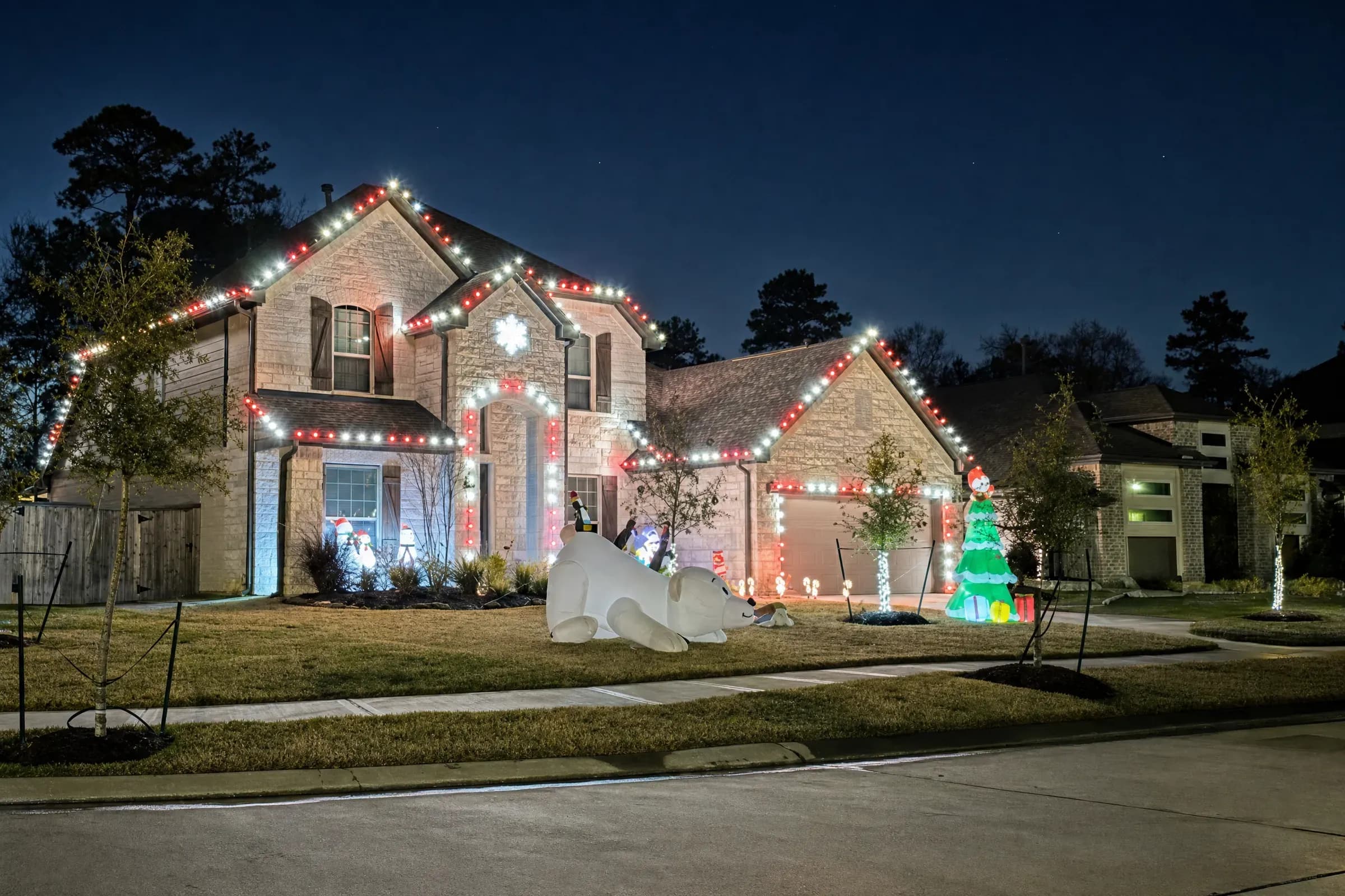Home in Bridgeland, Cypress with Christmas lights glowing at night